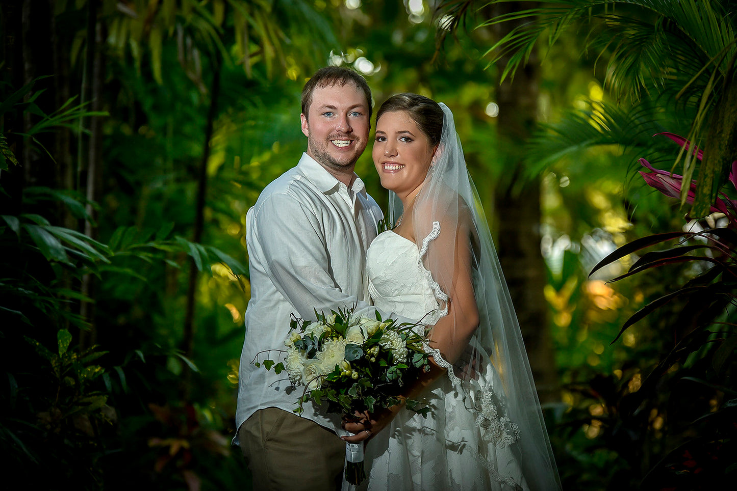 tropical forest wedding with bride in lace scalloped fingertip length bridal veil
