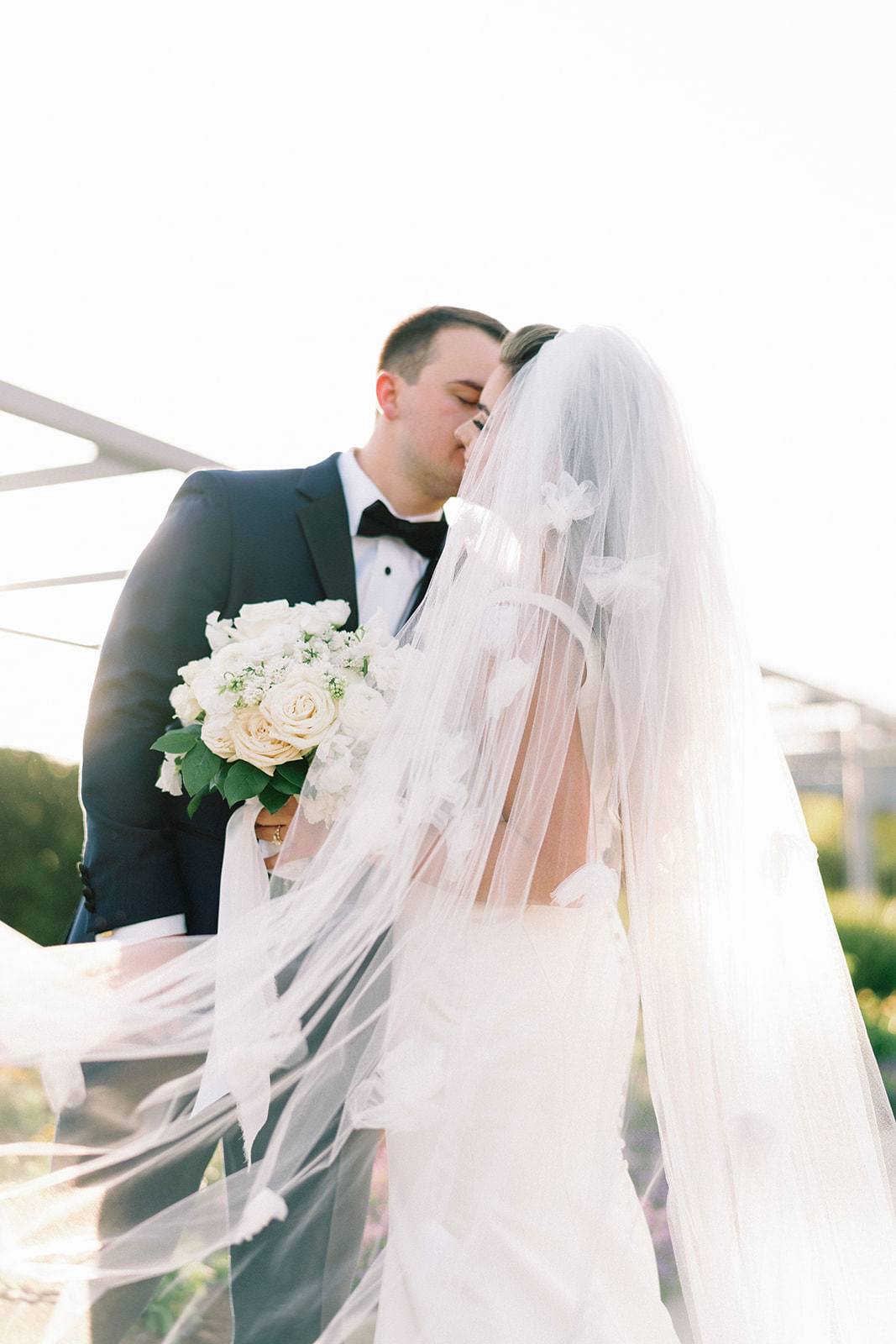 one blushing bride scattered flower romantic wedding veil 