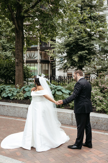 Ivory bridal hair bow cathedral veil for formal off the shoulder satin ballgown